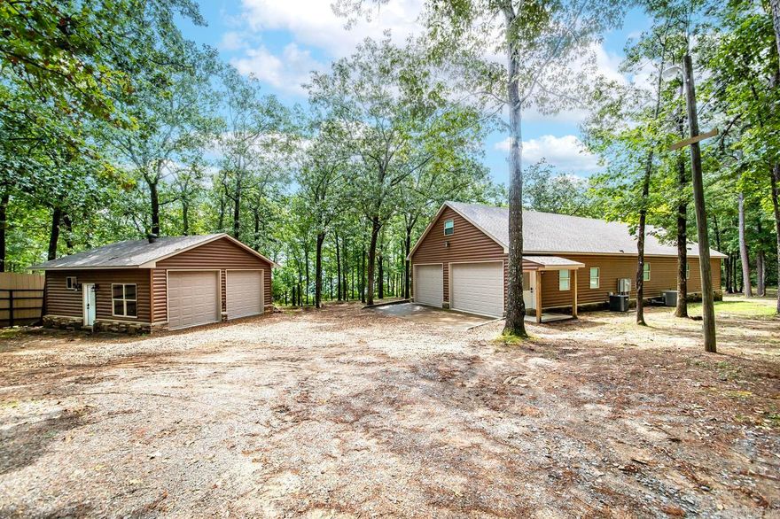 This beautiful cabin-style home offers the perfect blend of rustic charm & modern comfort. This property comes complete with lake views &a boat slip! Step inside this quality-built lake front home & be greeted by an inviting & cozy atmosphere. The open-concept living area features tall ceilings& large windows that flood the space with natural light, offering stunning views of the lake from many angles. Imagine waking up to the sound of gentle waves &sipping your morning coffee while taking in the serene beauty of the water. The spacious kitchen is just what you've dreamed of & you'll also find a delightful outdoor cooking space, ideal for hosting summer barbecues & enjoying alfresco dining with family & friends. After a day of boating & water activities, gather around the fire pit in the private backyard oasis. Roast marshmallows, share stories, & create lasting memories while enjoying the warmth of the crackling fire under the starry night sky. Retreat to the master suite, a tranquil haven featuring a luxurious ensuite bath & a private sunroom overlooking the lake.Whether you enjoy fishing, boating,or simply relaxing on the water, this lakefront paradise has it all. See it today!