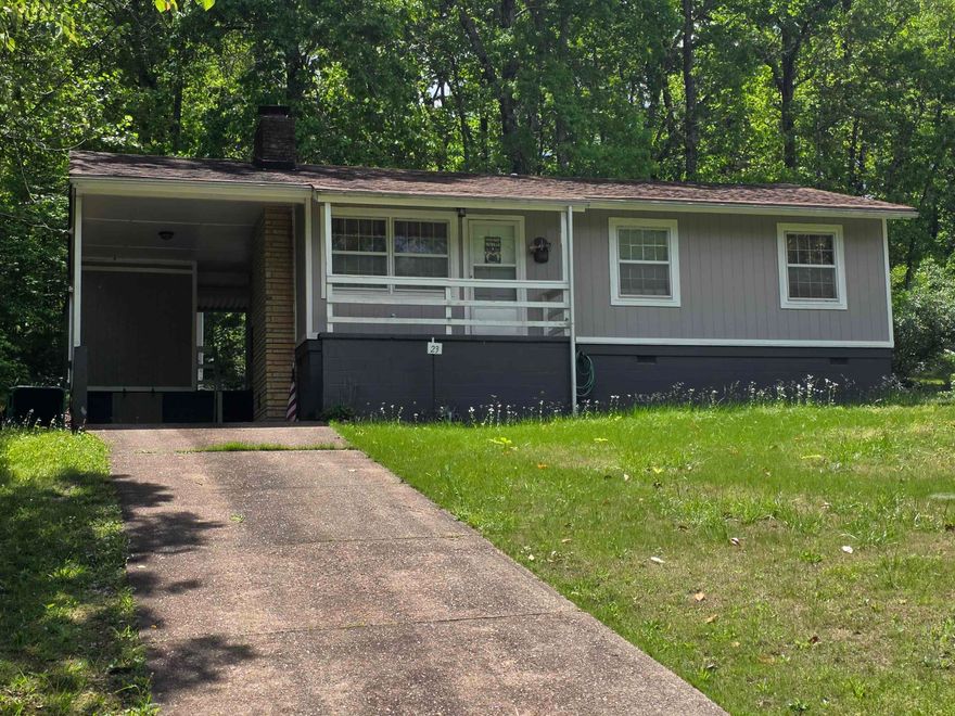 Great location for this very cozy, 2-bedroom, 1 and a 1/2 bath home. Home comes with fairly new laminate floors. All appliances stay. Some furnishings stay or can be removed. New roof, new siding, new interior paint and new flooring 2018. New AC was installed in 2019 and a new furnace in 2021. The large living room could be used as living/dining, or the large kitchen can be an eat-in kitchen. Sliding glass doors in the kitchen lead out back to a nice, covered cement patio and the carport storage, as well as the separate storage building or shop/she-shed. Architectural shingle roof. AWP installed new insulation in the attic and a vent fan in the Primary En-Suite bathroom in 2024. Updated septic tank, storm windows for energy savings and a beautiful built-in Sandstone fireplace that has been painted and piped in for gas logs. Cart distance to the North Golf course and the beautiful Southfork River. Cherokee Village property owners have access to 7 wonderful lakes, 2 beautiful 18-hole golf courses. The Thunderbird Center and of course the Southfork River. Come take a look at your new home, vacation getaway or retirement home today.