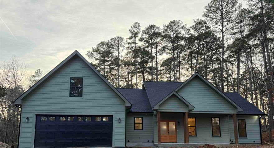 Brand New 2026 Construction. Welcome to this beautifully crafted 3-bedroom, 2.5-bath home located in the highly desirable Fountain Lake School District near the Glazypeaux gate of the Hot Springs Village.  Additional unfinished 400 sqft could be potential 4th bedroom. Thoughtfully designed for modern living, this brand-new construction offers both style & function with upscale finishes throughout. Step inside to an open-concept floor plan that flows seamlessly through the living, kitchen, and dining areas—perfect for entertaining or everyday life. The spacious living area features an electric fireplace that adds both charm & comfort. The kitchen is a standout, equipped with a large slab granite island & abundant counter space. Custom lighting beneath the cabinets creates a warm, sophisticated ambiance. The kitchen/dining combo allows for effortless meals & gatherings. The split-bedroom layout ensures privacy, with primary suite offering a serene retreat. Enjoy his-and-her vanities with granite countertops, a luxurious oversized walk-in shower, & custom walk-in closets complete the suite. Call today to schedule your private showing.