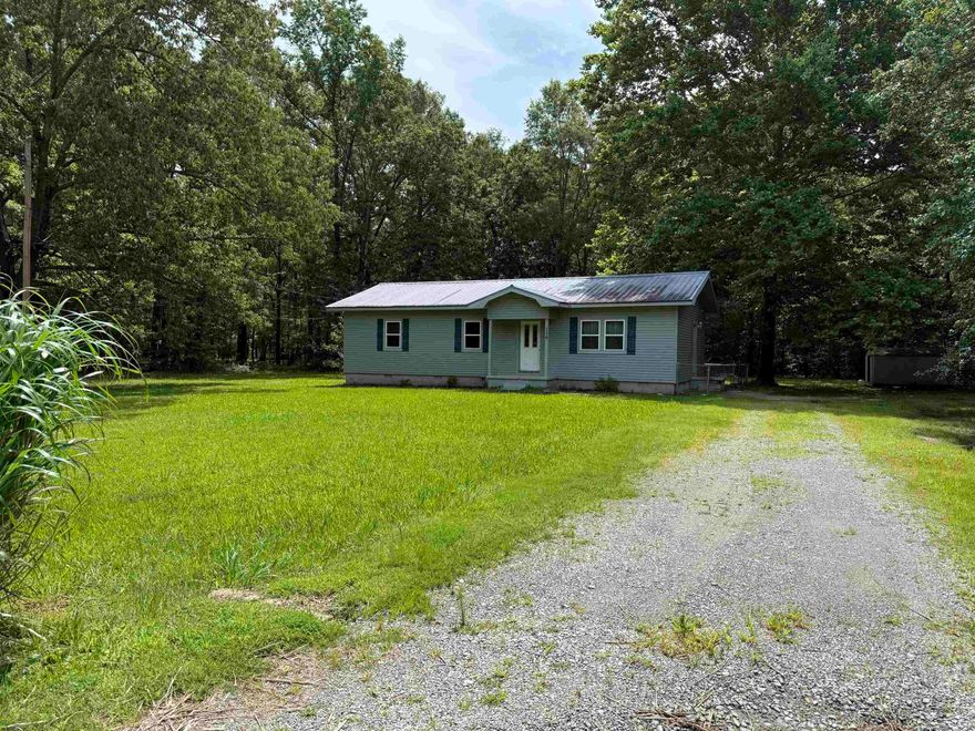 Great opportunity with 1.86 acres. ***RD ELIGIBLE AREA*** This 3 bedroom 1.5 baths would be a great opportunity with a little TLC.  Nice sized rooms, and space to build a shop. New HVAC system in 2023. Metal Roof, insulated vinyl siding, windows, replaced in 2005. Sit on the nice deck out back and enjoy morning coffee or a even a nice book.  Fenced back yard, storage building.  Don't miss this great opportunity