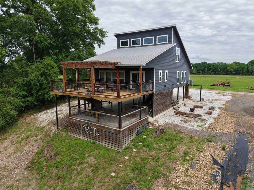 Rivertime is more than a cabin on the Caddo River — it’s a destination built for making memories. Whether you’re searching for a proven short-term rental investment, a weekend retreat, or a full-time riverside escape, this property delivers the perfect blend of recreation and relaxation. Enjoy direct access to the river for floating, fishing, and soaking in the natural beauty of the area, all while being surrounded by inviting outdoor spaces designed for entertaining, including multiple decks, a firepit gathering area, and a spacious yard.  Inside, the cabin offers an open and inviting layout filled with character, featuring a loft, bunk room, and thoughtfully crafted custom touches that set it apart from the ordinary. From cozy evenings after a day on the river to hosting guests outdoors, Rivertime captures the kind of lifestyle people come to the Caddo River to experience. Unique, memorable, and income-producing potential all in one — this is a property you’ll want to see for yourself.