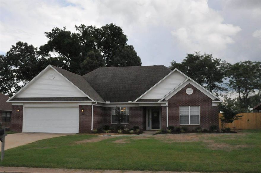 Open floor plan, updated home has large living room with raised ceilings. Previous owners had new HVAC installed with a UV Allergen Filter. New wood laminate flooring throughout with tile in the kitchen and baths. Great updated neutral paint colors throughout. Brand new privacy fence in back yard with a patio and landscaped front bed. GREAT SHAPE! Ready to move in!