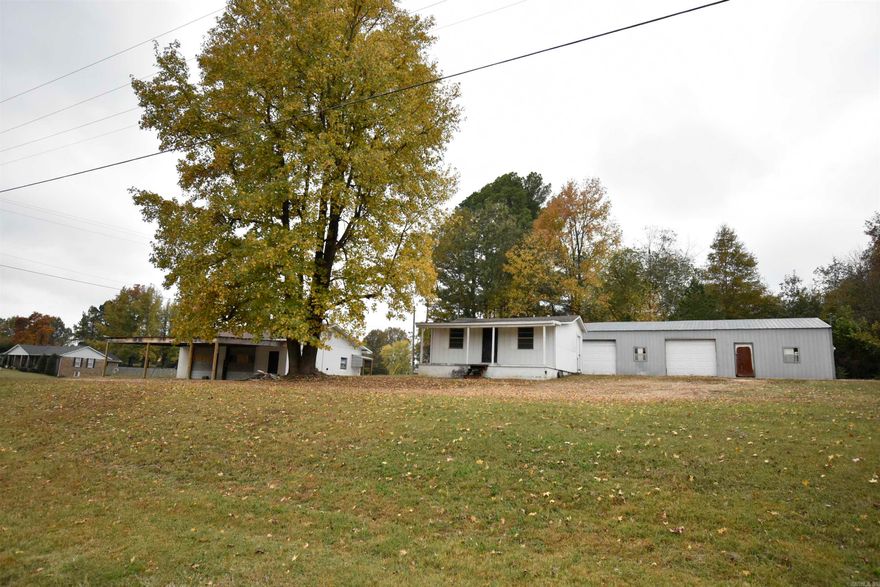 Prime Commercial Opportunity on a High-Traffic Corner Lot! Two separate garages 1) 32'x60' 2) 36'x44', previously used as mechanic shops — each with durable slab flooring and plenty of extra slab parking. Together, the buildings offer five total work bays, ideal for automotive use or adaptation to a variety of business ventures. A 24'x24' building has the potential for a seperate office/managament living quarters.  Zoned C-3 Commercial, the property allows for flexible use — perfect for a retail store, flea market, coffee shop, or other business seeking high visibility. Located on a busy, high-traffic highway corner, this property ensures maximum exposure and easy access. Whether you’re expanding your business or starting something new, this versatile site offers the space, visibility, and zoning to make it happen. *** Key Features: 1. Three separate commercial buildings 2. Five total work bays 3. Slab flooring and ample slab parking 4. HC / C3 zoning – wide variety of permitted uses Corner lot with excellent highway frontage and visibility Unlock the potential of this high-exposure property — a great fit for entrepreneurs and investors alike. (The property is not in use)