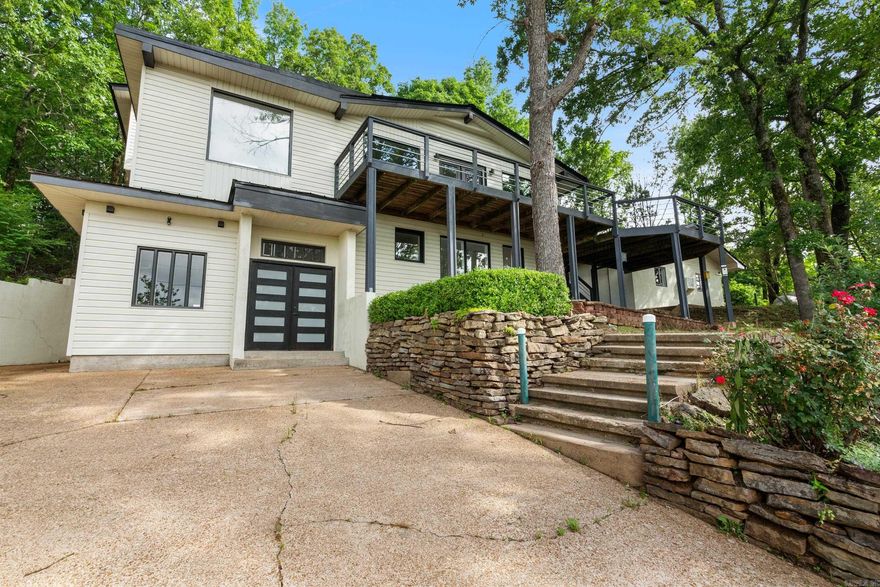 Stunning 4-Bedroom home with breathtaking views in Fairfield Bay! Welcome to your new sanctuary! This expansive 4 bed 3.5 bath home spans over 3,000 sq ft, offers unparalleled views of Sugarloaf Mountain and Greers Ferry Lake. This home is perfect for those seeking a blend of luxury, comfort, and natural beauty. Enjoy the panoramic views from the expansive decks. There is ample parking with 2 driveways and a detached 2-car garage. Residents have access to all the amenities Fairfield Bay has to offer, including golf courses, marina, hiking trails, ATV trails, tennis courts, pools, and miniature golf. This home offers the perfect combination of luxury living and natural beauty. Whether you're relaxing on the deck with a view of the lake, cooking in your state of the art kitchen, or exploring the local amenities, this property promises exceptional lifestyle. Call for your private viewing.