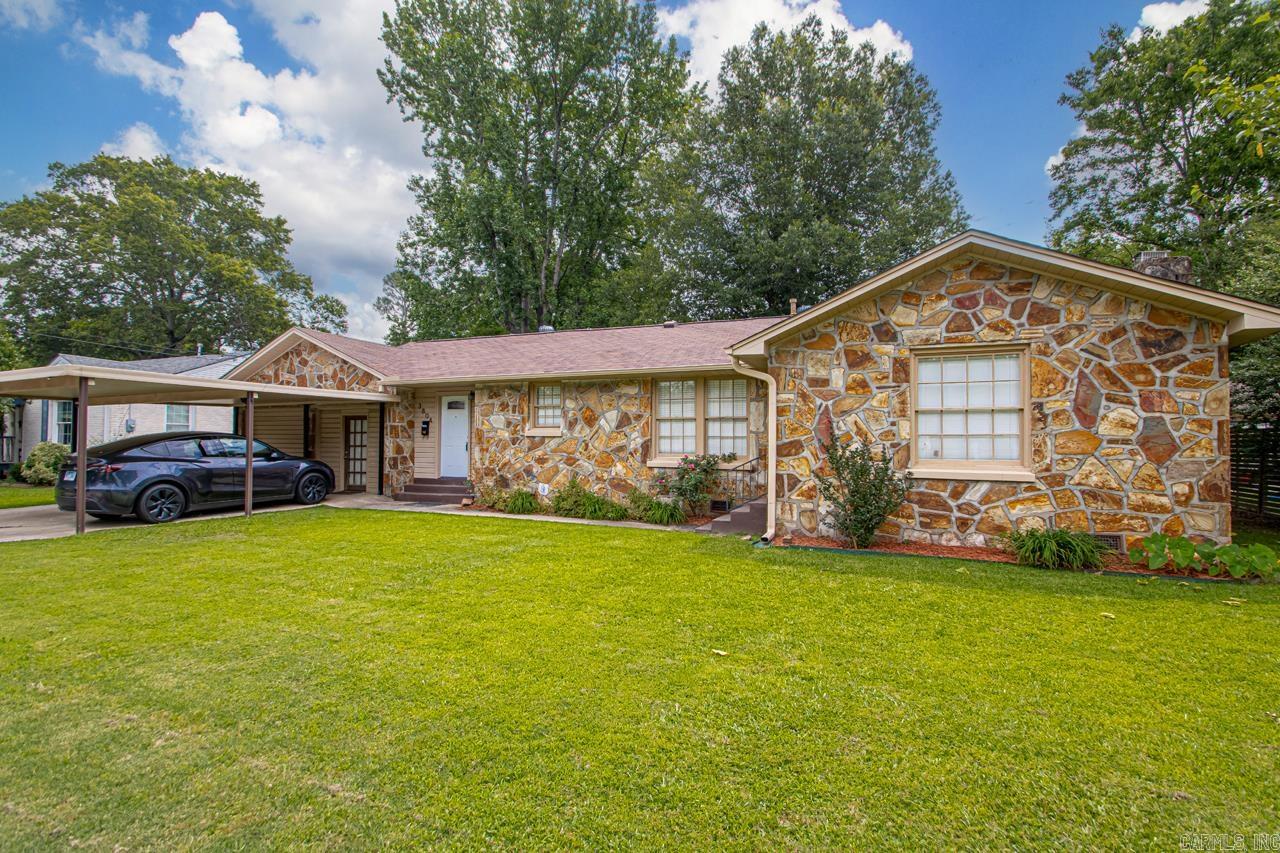 Nestled in historic Park Hill, this property offers a unique blend of charm and modern functionality, making it ideal for both practical living and leisure. The thoughtful renovations and well-planned design ensure comfort and convenience for its next owners. The shaded backyard features a 1,050 sq ft (30'x35') insulated metal building with a 240 sq ft loft for extra storage. The primary bedroom and bathroom have been renovated, including a walk-in closet, double vanity with quartz counter top, walk-in shower, and private water closet. The kitchen has hickory cabinets, granite counter tops, a farm sink, and a commercial grade "Wolf brand" double oven, gas range and griddle cook top. Other updates include new LVT flooring, a new shiplap ceiling in the family room, an updated guest bathroom, and a new Takagi tankless water heater. There is a 250 sq ft bonus room with a 8x12 built-in cabinet and is wired for surround sound; suitable for use as a media room, office, or game room. Schedule your showing today!