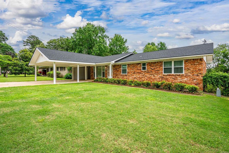 INVESTORS ALERT! Discover a turnkey investment opportunity in the sought-after Little Chicago neighborhood of Hot Springs, Arkansas!  This charming, 1308 sq. ft. brick home features 3 updated bedrooms, 1.5 bathrooms, and original hardwood floors that add timeless appeal. The property is low maintenance with energy-efficient updates like insulated windows, storm doors, and a new roof.  The -free income generating property.  Schedule a tour today! carport adds value with extra storage and a laundry room.  Enjoy a covered patio overlooking a serene backyard. Best of all, this home already has a responsible long-term tenant paying $1795/month in market-rate rent!  Don't miss out on this hassle-free, income-generating property-schedule a tour today!