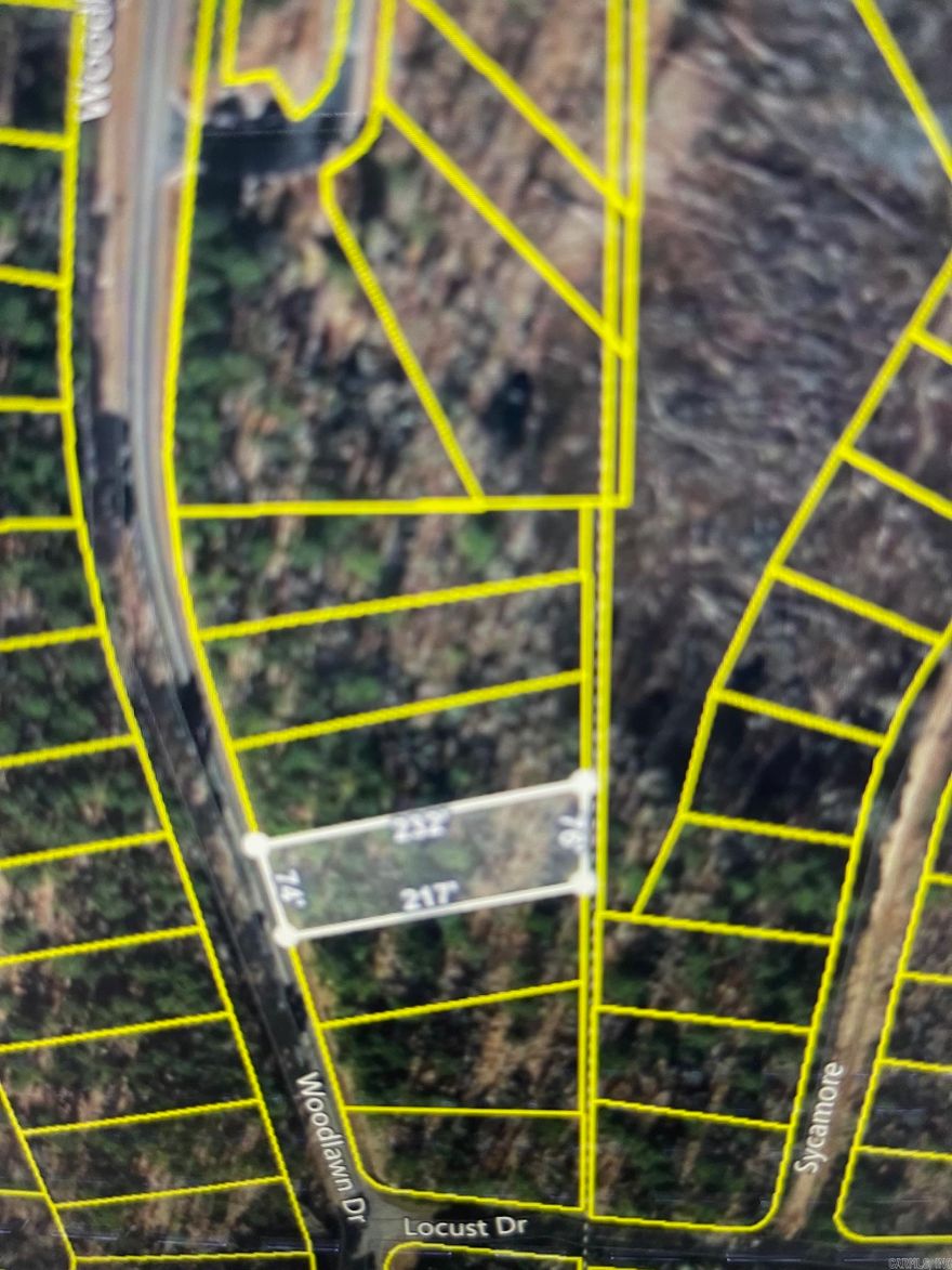 Welcome to your own slice of paradise in beautiful Fairfield Bay, Arkansas! This spacious double lot  with partial lake & mountain views offers the perfect opportunity to build your dream home in one of the most desirable locations in the state, with access to a wealth of amenities.  Just minutes away from stunning Greers Ferry Lake. Whether you're an avid fisherman, boater, or simply enjoy relaxing by the water, this location has something for everyone. But that's not all Fairfield Bay also offers a wide range of amenities to its residents, including 3 swimming pools, 2 18-hole golf courses, hiking and biking trails, ATV/UTV trails, pickleball and tennis courts, and a full-service marina. Whether you're looking for outdoor adventure, a friendly game of tennis, or a relaxing day by the pool, Fairfield Bay has you covered. The lot itself is generously sized and offers plenty of room for your custom-built home, as well as any additional amenities you desire. With easy access to utilities and services, including water, sewer, and electricity, you'll have everything you need to make your dream a reality.  Buyer to pay all closing costs and title insurance. See agent remarks.