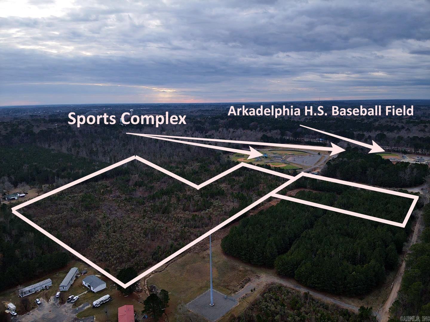 MULTI PURPOSE PROPERTY awaits you for your next project or development. 23.50 Acres conveniently located to the Arkadelphia Youth Sports Complex. Prime location with 2 access points (1) from Country Club/Thompson Road (2) Hwy 67/Flowers Road. Residential, Regular Commercial, or Multi-Family Housing, or even an RV Park~ with access to sewer, water, gas through the city of Arkadelphia. Close to  I-30, Henderson State and Ouachita Baptist Universities. For Zoning~ See Agents Remarks!  Call Today!