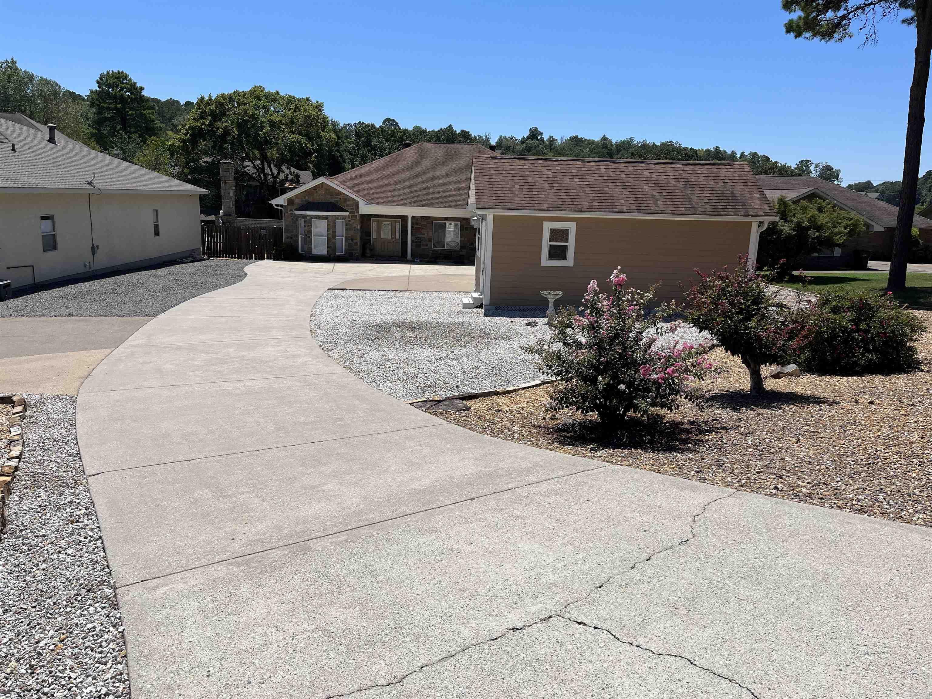 Custom Lake House w Pool! This home features lots of extras including a workshop with mini split (AC/Heat), 2 outbuildings, 2 personal watercraft lifts, boat slip and lift, boardwalk with swim ladder, RV pad with full hookups, and heater insert for the 16x20 pool, the list goes on and on! You will love the low maintenance yard with its flagstone backyard and the outdoor patio that is accessible from the bedroom. The MBD also has its own exterior access with a custom walk-in closet and a huge soaker tub! This home has been well maintained with lots of upgrades like granite in kitchen and baths, built-in shelving in closets, all new SS appliances w trash compactor, and a power pet doggie door! Other notable features include the split floor plan and open concept design with a bonus den area, arched doorways with columns, gas range, bay window, huge laundry area, and a bonus room for extra storage off the 2 car garage. This Home Sweet Home could be yours since the sellers are relocating, which means they are MOTIVATED! Book Today!