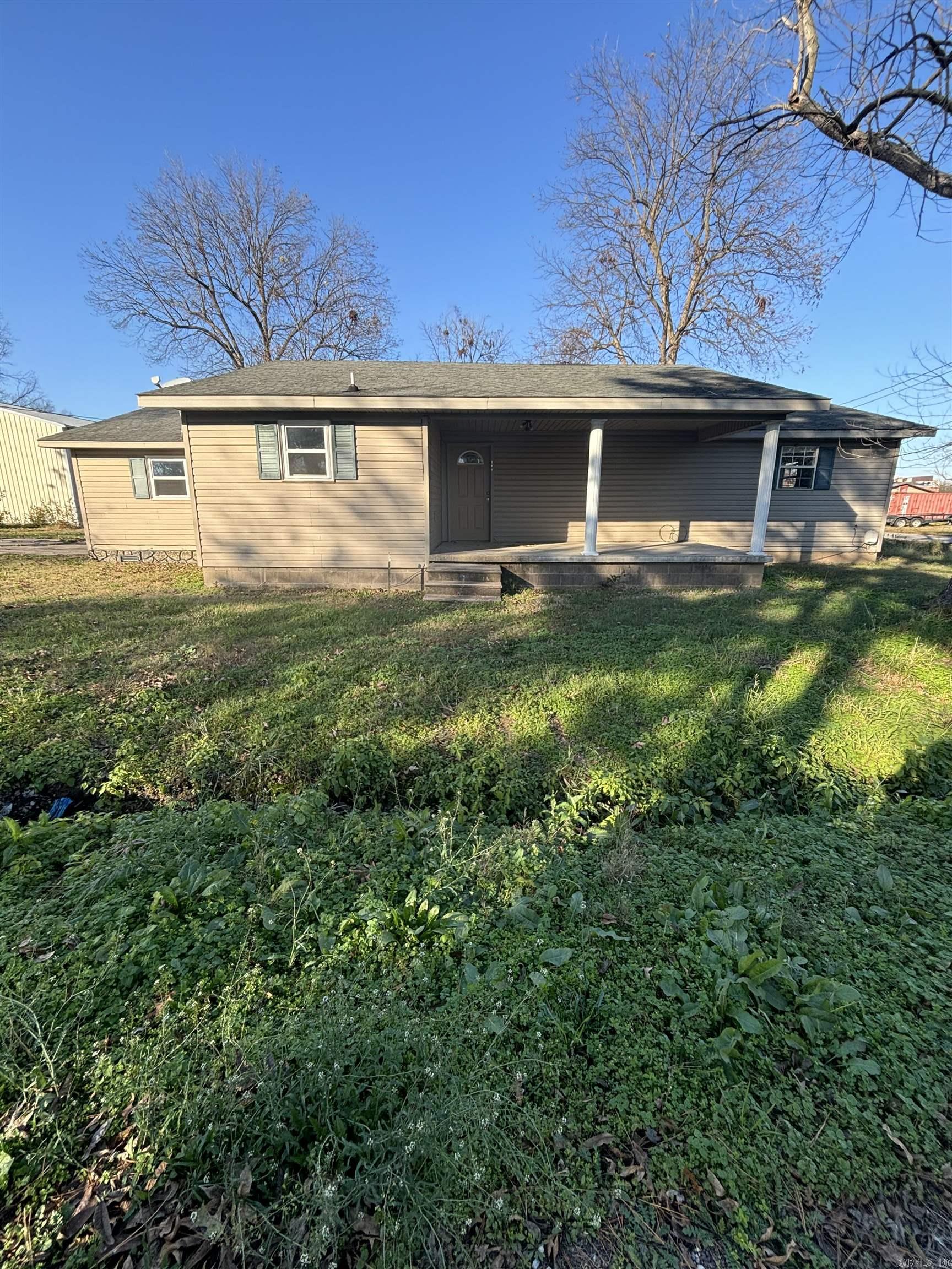 Great investment opportunity on a corner lot. Sold as is.