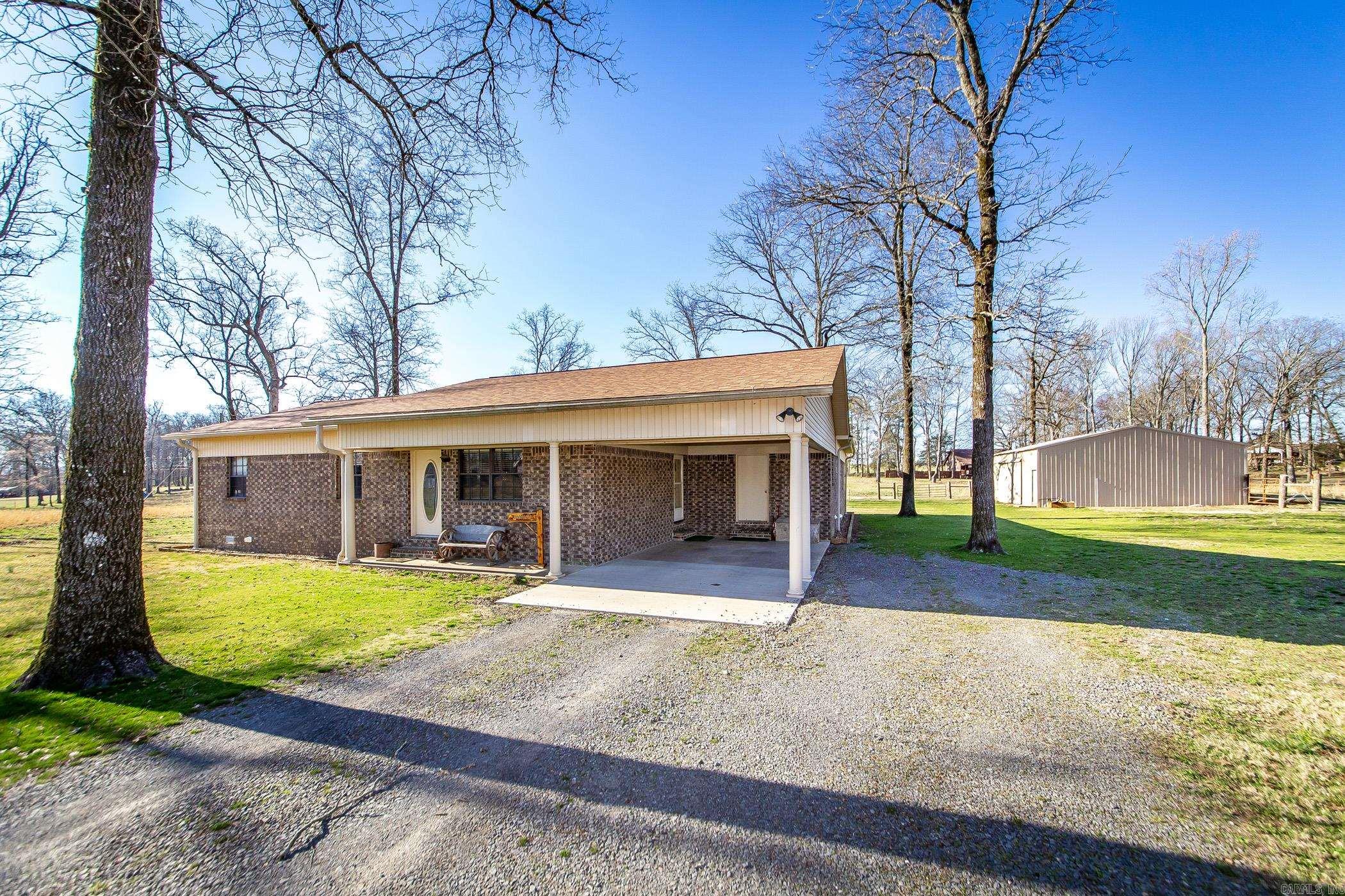 New to the market, this well built 4-bedroom, 3-bath brick home offers the perfect blend of city convenience and country charm, within the city limits but nestled on a peaceful paved road. Featuring two primary suites with en-suite bathrooms, a dedicated office space and lots of storage. The expansive great room, along with a spacious living room, is ideal for family gatherings and entertaining. Outside, you'll find a large shop with electricity, perfect for hobbies or additional storage, along with plenty of fenced pasture – an ideal setup for horses or farm animals. Best of all, this property is less than 6 miles from the beautiful Greers Ferry Lake and marina, offering endless opportunities for boating and outdoor recreation. With its serene atmosphere, prime location, and proximity to the lake, this home is a rare find!
