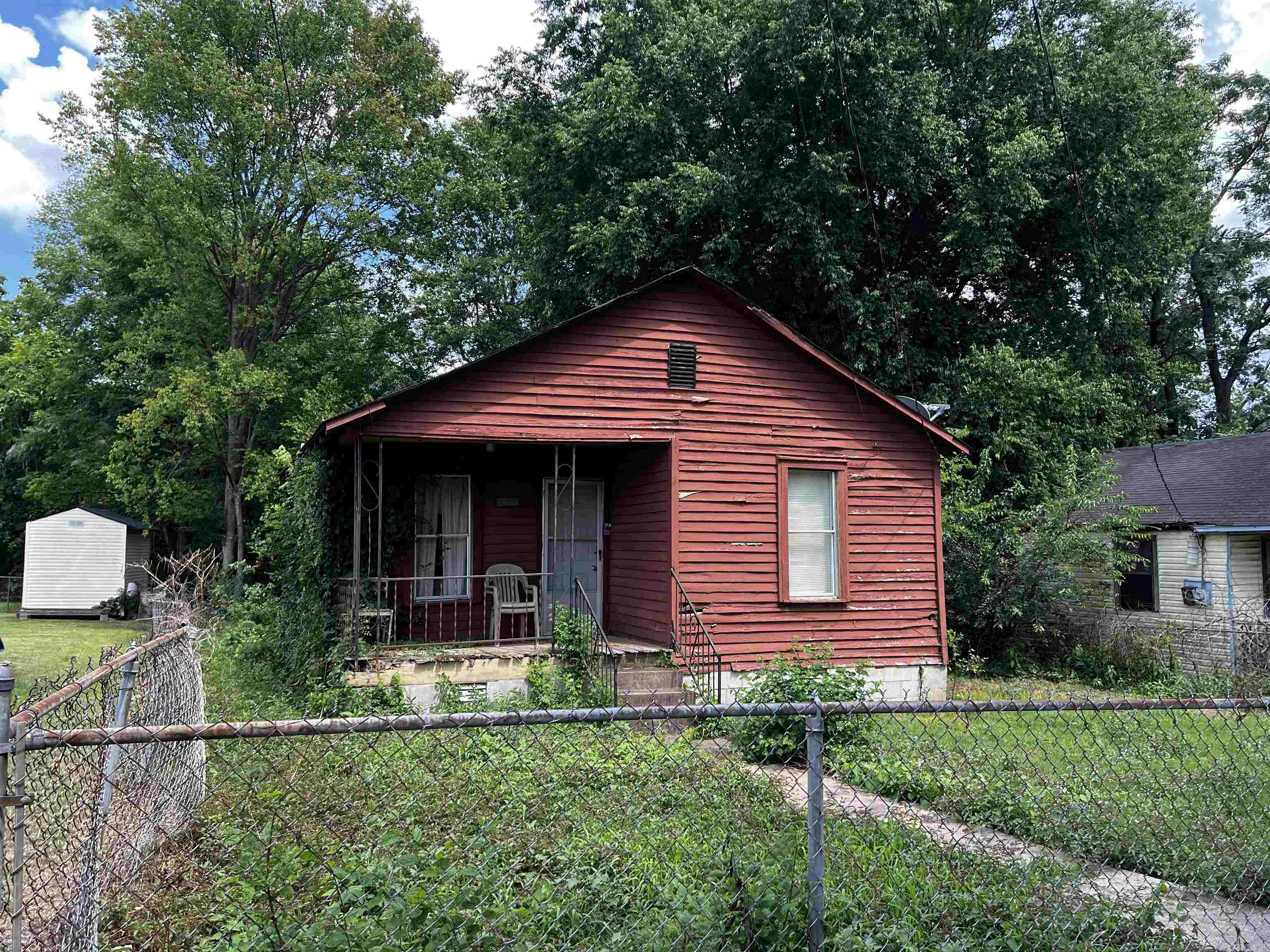 This one needs work but could be a great property with the right owner making the needed renovations. Completely fenced yard. Sitting on a dead end street so not a lot of traffic to worry about. Bring your hammer, nails and some know how to get this one back to pristine condition. Priced to sale quickly. No Seller Property Disclosure. Sold AS IS with any contents remaining. Some floors and porch have some issues so enter at your own risk.