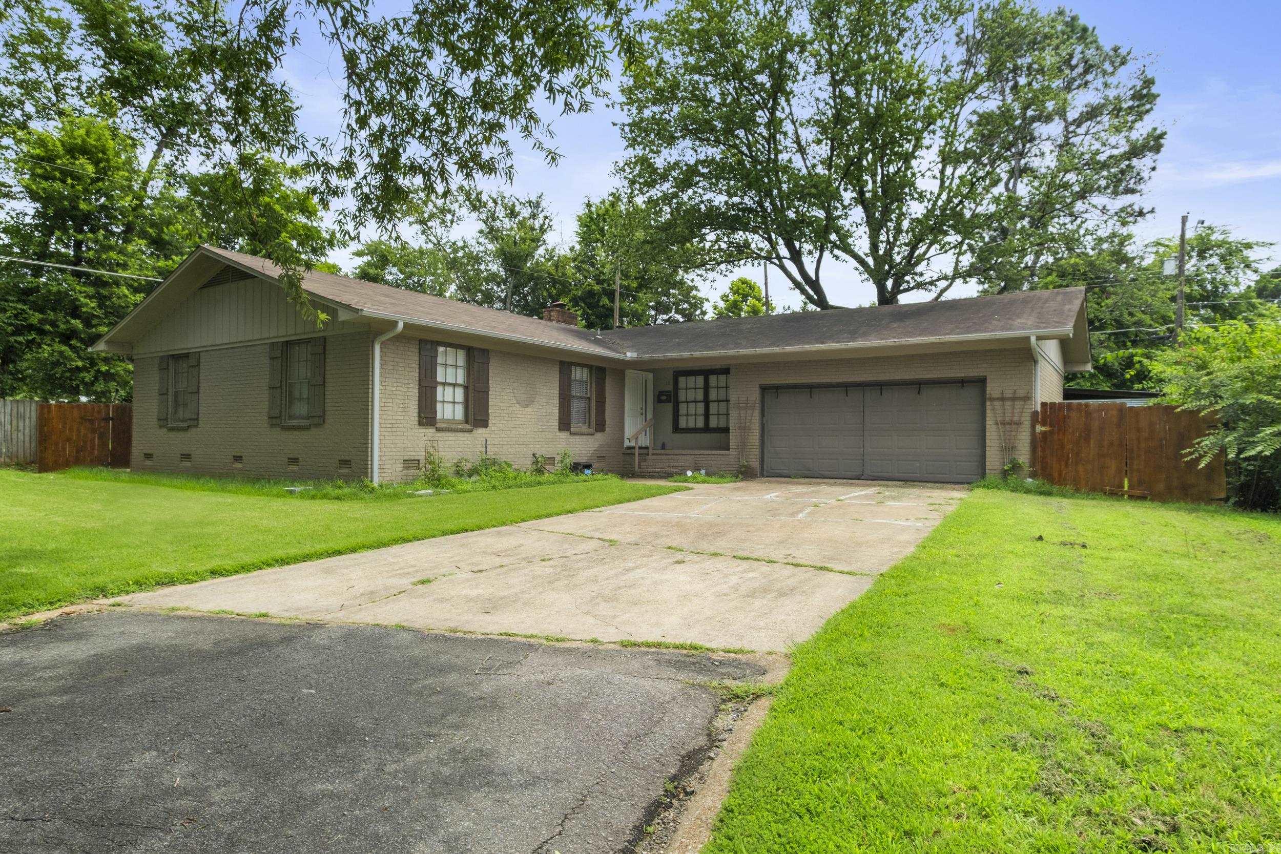 Back on market due to buyer having a life event. House appraised with no required repairs! Seller has gotten quotes for window replacement and is open to replacing them with an acceptable offer. 3 bedroom, 2 bath +/- 1700 square foot home nestled at the end of a cul-de-sac near Searcy High School. Beautifully updated kitchen boasts stainless steel appliances, eat-in bar, built-in desk, backside bar cabinets, set in a open concept. All original hardwood floor and tile throughout. Recent upgrades include new roof 2019, water heater 2021, new front door 2022, rain gutters with leaf guards 2023, french drain 2023, AC cleaned and new fan 2024, plumbing serviced 2024, laundry room renovated 2025. Outside enjoy spacious front and backyards, a 2 car garage, lean to, large barn shed, and storm shelter. RV gate! Square footage approximate, please measure.