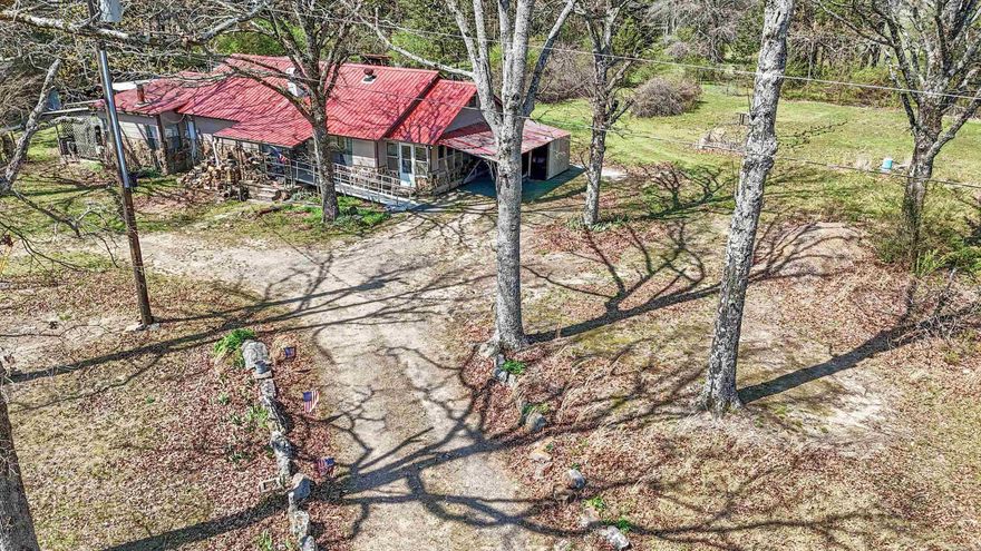 Charming rock farmhouse that has stories to tell. Situated on 1 acre. This adorable home offers peaceful living with convenient access to nearby Heber Springs & beautiful Greers Ferry Lake. Enjoy all that lake life has to offer just a short drive away, including fishing, boating, swimming, hiking, & endless outdoor recreation opportunities. The home features 3 bedrooms & 2 baths, along with 2 additional flexible rooms that could serve as offices, hobby spaces, or guest areas. Includes a bright sunroom facing east. The property is well equipped for homesteading or gardening enthusiasts, featuring approximately 2,000 square feet of raised garden beds. The land is rich with established plantings including muscadine grapes, blueberry bushes, blackberry, fig trees, roses, & lilies, offering both beauty & productivity. There's also a chicken house designed for 30 chickens with a fenced run & an attached rabbit cage, making this a great setup for small scale farming or sustainable living. This property offers character, space, & incredible potential for anyone looking to enjoy a more s lifestyle in a peaceful country setting. Seller planning on leaving all appliances and furniture.
