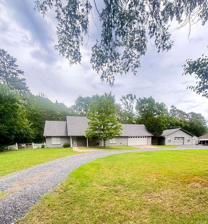 Spacious 3 bedroom 2 bath home features 1966 sq ft of living space, vaulted ceilings, a private backyard and patio, and a second 1200 sq ft garage or shop that is wired for 220 and plumbed for an air compressor. Shop also has an electric furnace. Located in a serene cul-de-sac in Mena, AR, this home is close to area amenities and would be perfect for entertaining. There is a large walk-in closet off the primary bathroom and extra storage in the laundry area. Home also features large circle driveway and enclosed breezeway. New water heater! See agent remarks.