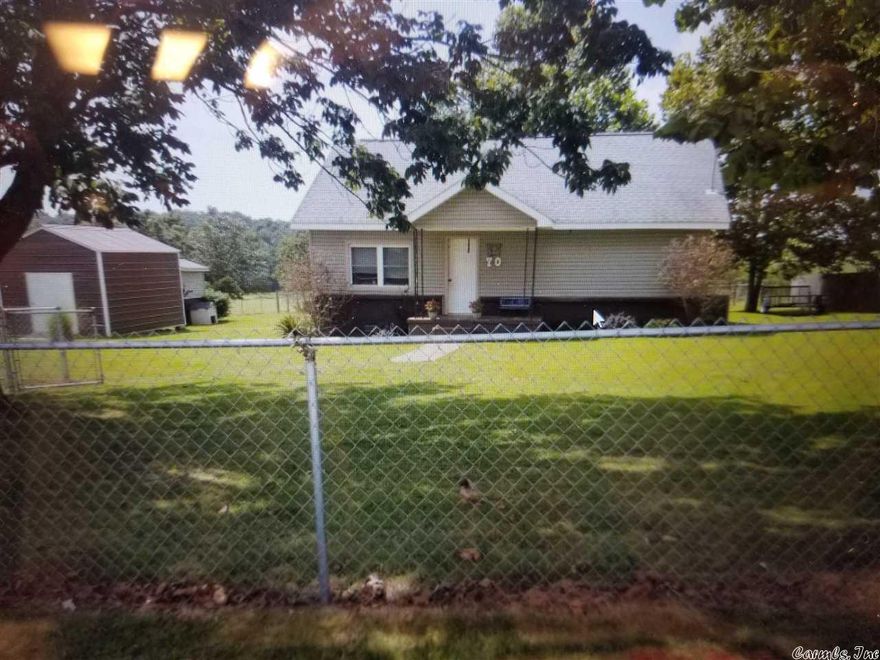 Cozy 3 bedroom 2 bath house on 0.5 acre. Has two buildings on property for great storage or man cave or she shed. Fenced in yard. Small front porch to watch the sun rise. Has a storm shelter on property as well.