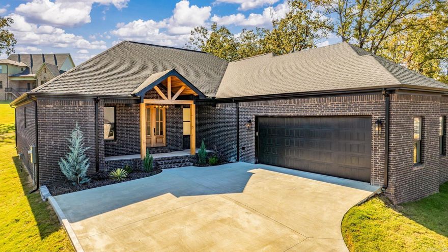 Beautiful custom all-brick home featuring a maintenance-free exterior w/black windows,charcoal gutters,brick mailbox & side-load 2-car garage w/storage.The inviting 21ā cedar post-lined entry showcases solid wood double arched doors, under-eave lighting & custom iron fixtures.Inside,the open living area offers 10ā ceilings,wide-plank luxury vinyl flooring,recessed lighting & a gas fireplace w/floating cedar mantle.The kitchen includes an 8ā quartz island w/farmhouse sink,custom soft-close cabinetry w/pull-outs,pot filler,tiled backsplash & Frigidaire Gallery appliances.The master suite features a spacious bedroom,custom double vanity w/quartz counters,freestanding tub,frameless glass shower,private toilet room & 12ā x 12ā walk-in closet w/built-ins. 2 Additional bedrooms include a Jack & Jill bath & a seperate quest/in-law bedroom joins a private hall bath,4 total bedrooms in 3 seperate areas.Custom cabinetry continues in the pantry & large laundry room.All solid wood interior doors & a Covered back patio w/wood ceiling, lighting & ceiling fan.One of the BEST Floorplans out there,open & spacious in all the right places! A True Must See!