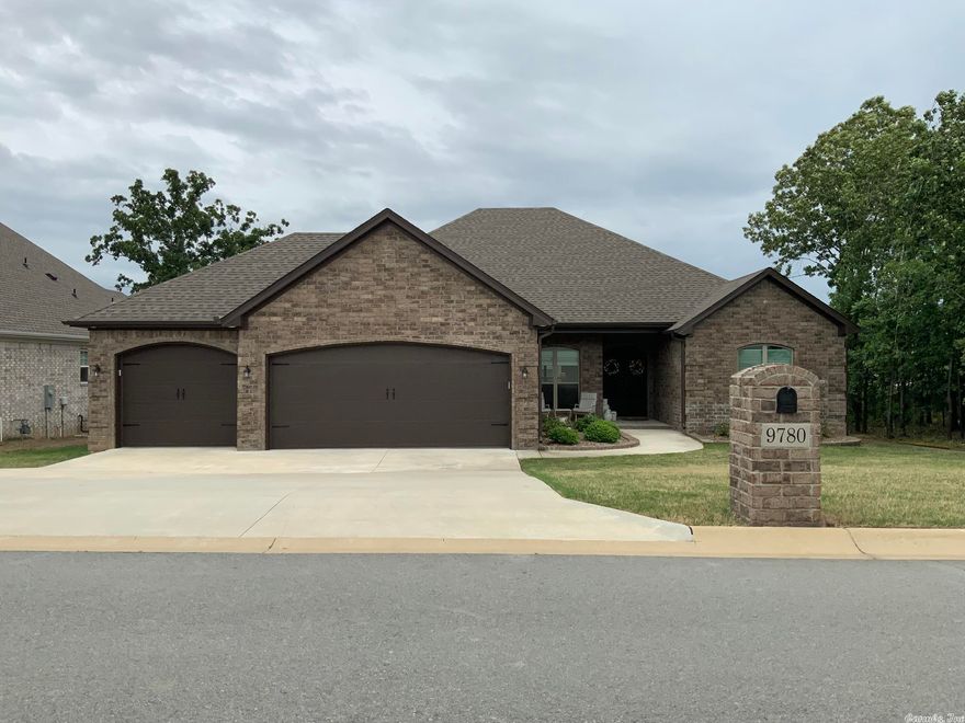 SPACIOUS FLOOR PLAN: This 4 bedroom, 2.5 baths home features a open concept with a split floor plan. Kitchen features a large island with granite, white soft close painted cabinets, walk-in lighted pantry, stainless steel appliances and a gas surface range.  Large living room with a corner fireplace.  Master suite has a double sink, soaking tub and a separate tiled walk in shower.  Don't miss the covered patio and a sun deck with premium Trex composite decking.  The gorgeous front doors are premium iron security. Walk up stairway to a floored attic, sprinkler system, a storage closet in the garage and a privacy fenced back yard. ( generator does not convey) SF approx. measuring encouraged.