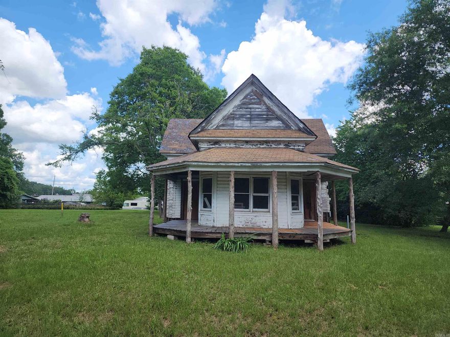 A true bargain - just needs some TLC! This 2 bed, 1 bath home was built in the 1920's and sits on 4 city lots. Some electrical has been updated, all building materials inside the home are included. Storm shelter located on the property. Endless possibilities with this home!