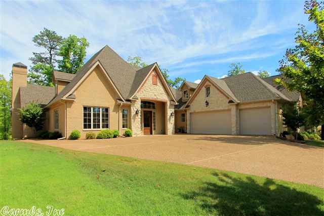 Offering a gated Bayview Estates location is only the start of this attractive listing. Not only is this an extremely attractive floorplan with approximately 4754 square feet of well-planned space on two floors; it offers a breathtaking lake view and is on a quiet cove with a view of the main channel. What more can one ask? This four bedroom, 3.5 bath home features a stunning French exterior of stone and brick with wonderful landscaping and lake access.