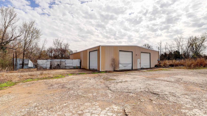 Large warehouse on 31 acres. Railroad easement on property. Great location for your new business!