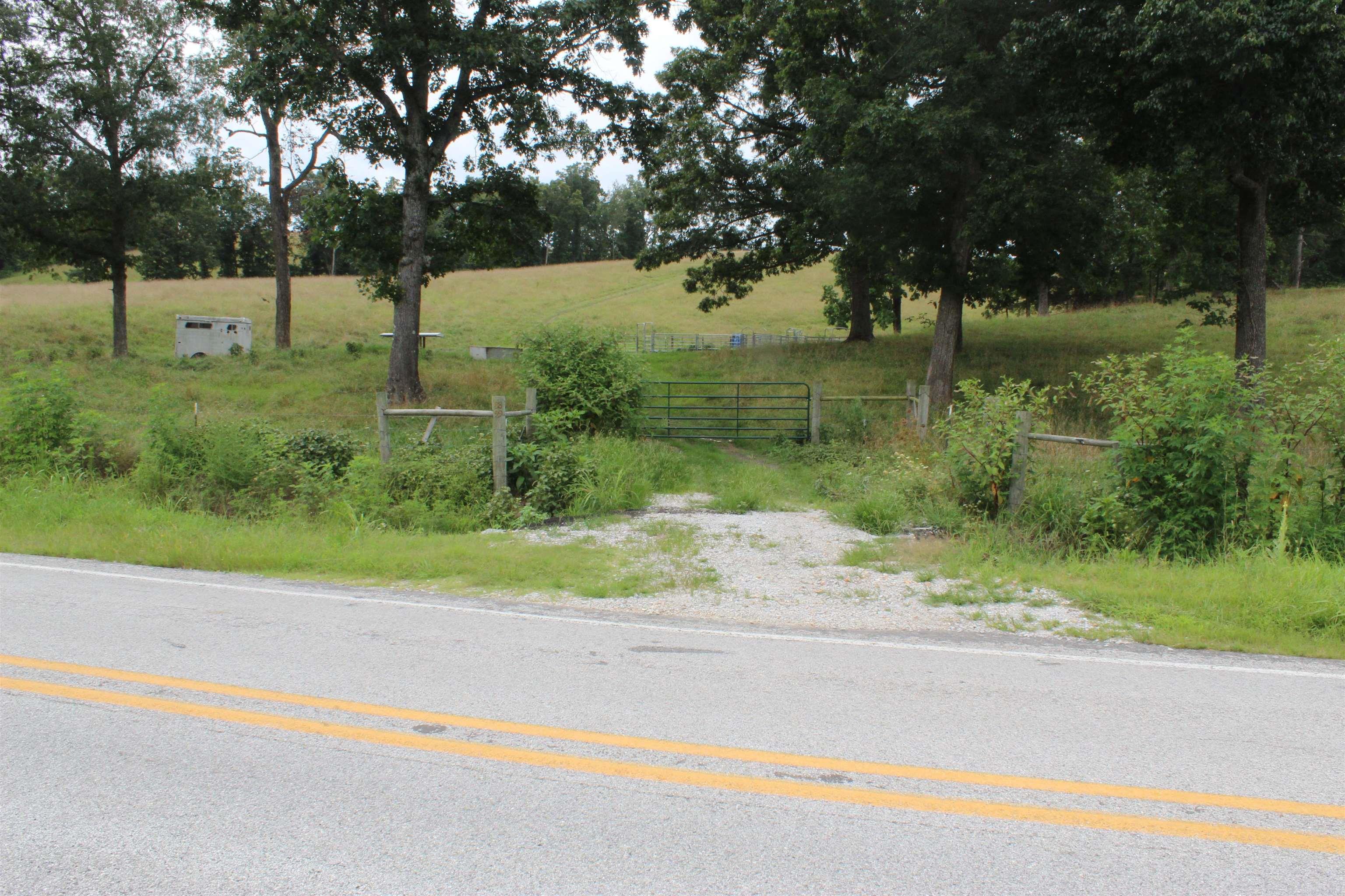 Beautiful 51 +/- acres in the heart of the Ozarks, offering multiple building sites with scenic views. Property has highway frontage for easy access, with electric, public water, and fiber internet available. Mostly cleared and fully fenced with lush pastureāideal for cattle, horses, or other livestock. Features two stock ponds and a water tank. An abundance of wildlife including deer, turkey, and bear makes it a great spot for hunting or nature watching. Located just 15 minutes from Marshall for daily needs and only 15ā20 minutes to the Buffalo National River for hiking, fishing, kayaking, and canoeing. Branson, MO is only 1 hour 45 minutes away for shopping and entertainment. Enjoy evenings at the local Kenda Drive-In or peaceful nights under the stars. This property offers a rare combination of convenience, natural beauty, and recreational opportunityāperfect for building your dream home or your very own farm in the Ozarks.
