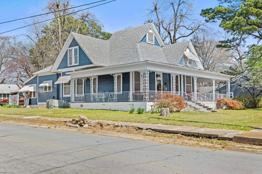 Step into timeless Southern charm with this stunning 1910-built Victorian, gracefully positioned on a sprawling corner lot in the heart of Searcy. With over 3,100 square feet, this 6-bedroom, 2-bath home offers the perfect blend of character, scale, and opportunity. From the moment you arrive, the wraparound porch invites slow mornings and golden-hour evenings, while inside, original architectural details and two fireplaces create a warm, story filled atmosphere you simply can’t replicate. Whether you’re dreaming of a spacious personal residence, a multi-generational home, or envisioning a boutique bed & breakfast, this property delivers unmatched versatility and presence. Homes like this don’t just exist, they’re experienced. Call for your private showing!