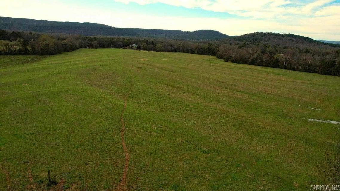 ''Discover tranquility on this expansive 177-acre property, featuring approximately 80-90 acres of pastoral fields, complemented by dense woodlands, two tranquil ponds, and abundant wildlife. Embrace the essence of nature's embrace on this idyllic land.''