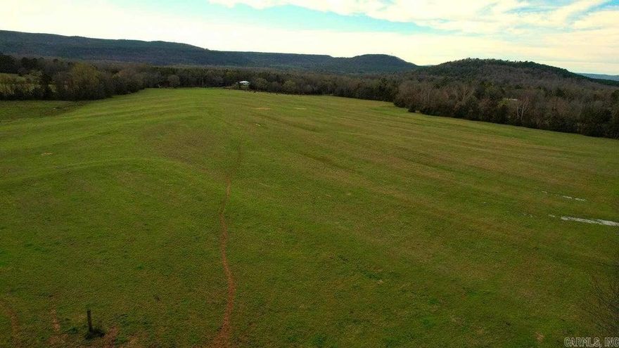 ''Discover tranquility on this expansive 177-acre property, featuring approximately 80-90 acres of pastoral fields, complemented by dense woodlands, two tranquil ponds, and abundant wildlife. Embrace the essence of nature's embrace on this idyllic land.''
