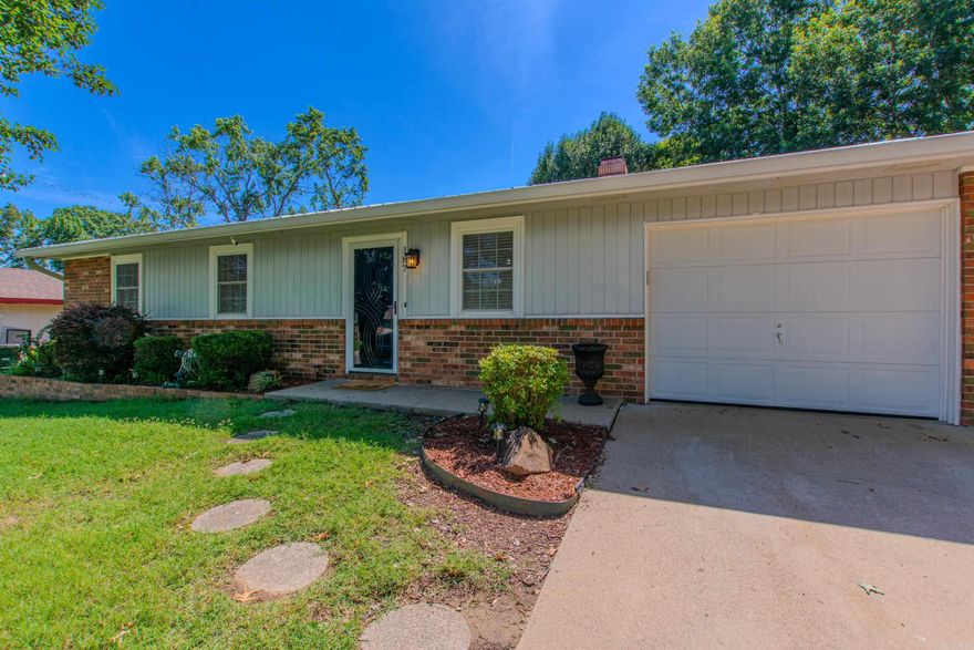 This charming 3BR/1.5BA home is full of character and curb appeal! Features include laminate flooring throughout, updated bathrooms, a cozy fireplace, and a 1-car garage. Enjoy relaxing mornings or peaceful evenings on the screened-in patio overlooking the backyard. The outdoor space also includes a shed on a permanent foundation for extra storage or workspace. Topped with a durable metal roof, this home combines comfort, style, and functionality all in one!