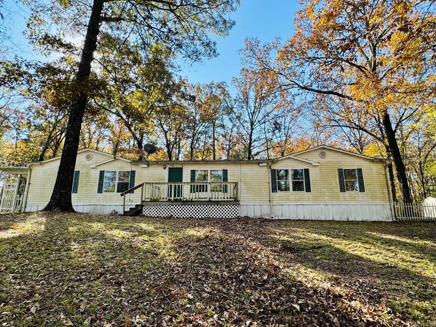 Double Wide Manufactured Home nestled on acreage located in a private country setting within the Centerpoint School District. Home features 4 bedrooms, 3 full bathrooms, central heat, central cool, split floor plan, patio covered aluminum wood deck, wood deck, detached covered parking and outside storage buildings. Spacious kitchen and dining, formal dining, living room and den with fireplace. HUD Case #031-500955. FHA Financing: IE (Insured Escrow) Property is sold in as-is condition, no warranties, guarantees or representations.