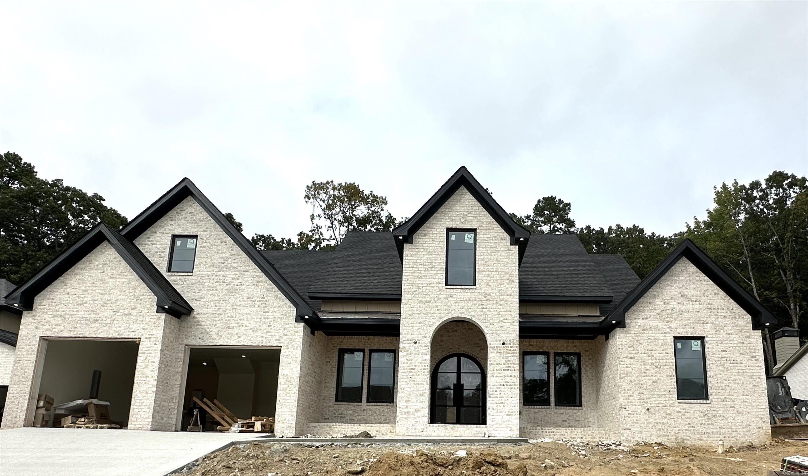 Welcome to 112 Bear Den Court, a stunning new construction home offering luxury, functionality, and timeless design in one of West Little Rock’s most desirable areas. Step inside and experience an open-concept floor plan filled with natural light, high ceilings, and beautiful finishes throughout. The spacious living room flows seamlessly into a designer kitchen featuring custom cabinetry, quartz countertops, stainless steel appliances, and a large island perfect for entertaining. The primary suite is a true retreat with a spa-inspired en suite bath, soaking tub, and generous walk-in closet. Three additional bedrooms provide comfort and flexibility for family, guests, or office space. Upstairs, you’ll find a bonus room with a full bath and closet — ideal as a fifth bedroom, media room, or private guest suite. Enjoy outdoor living on the covered patio, overlooking a private backyard ready for your personal touch. This home blends modern luxury with everyday comfort, a perfect fit for families or anyone seeking a brand-new home built to impress.