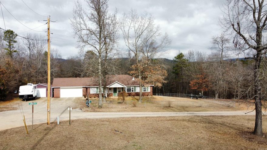 Unveil the charm of rural living with this exquisite 3-bed, 2-bath country home set on 2.49 acres in a well-established subdivision. Enjoy the tranquility of a corner lot, perfect for relaxation and exploration, with easy access to ATV trails and the pristine national forest. A spacious master suite, open floor plan, and a cozy wood-burning fireplace make this home a haven for all seasons.