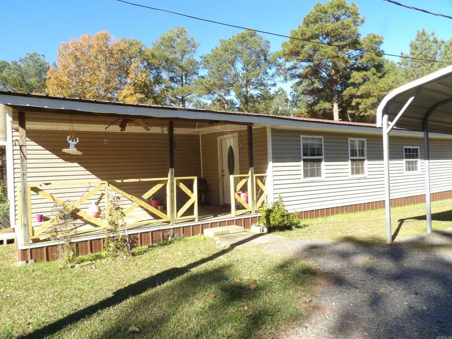 This quaint & cute home is located approx. 5 miles from town. Owner built this home with 2 bedrooms & 2 full baths. There is a 3rd room that could easily be used as a 3rd bedroom currently used for storage and no closet. Spacious eat-in kitchen with granite countertops, nice cabinets, gas range & refrigerator will convey.  Open concept kitchen & living room with space for a separate dining area if desired. Two window units + 2 gas space heaters will convey. Also included is a detached double carport, shop and storage building.  You'll love the covered deck in back.  Room to roam here with over 7 acres.  Call today to schedule an appointment to see this home.