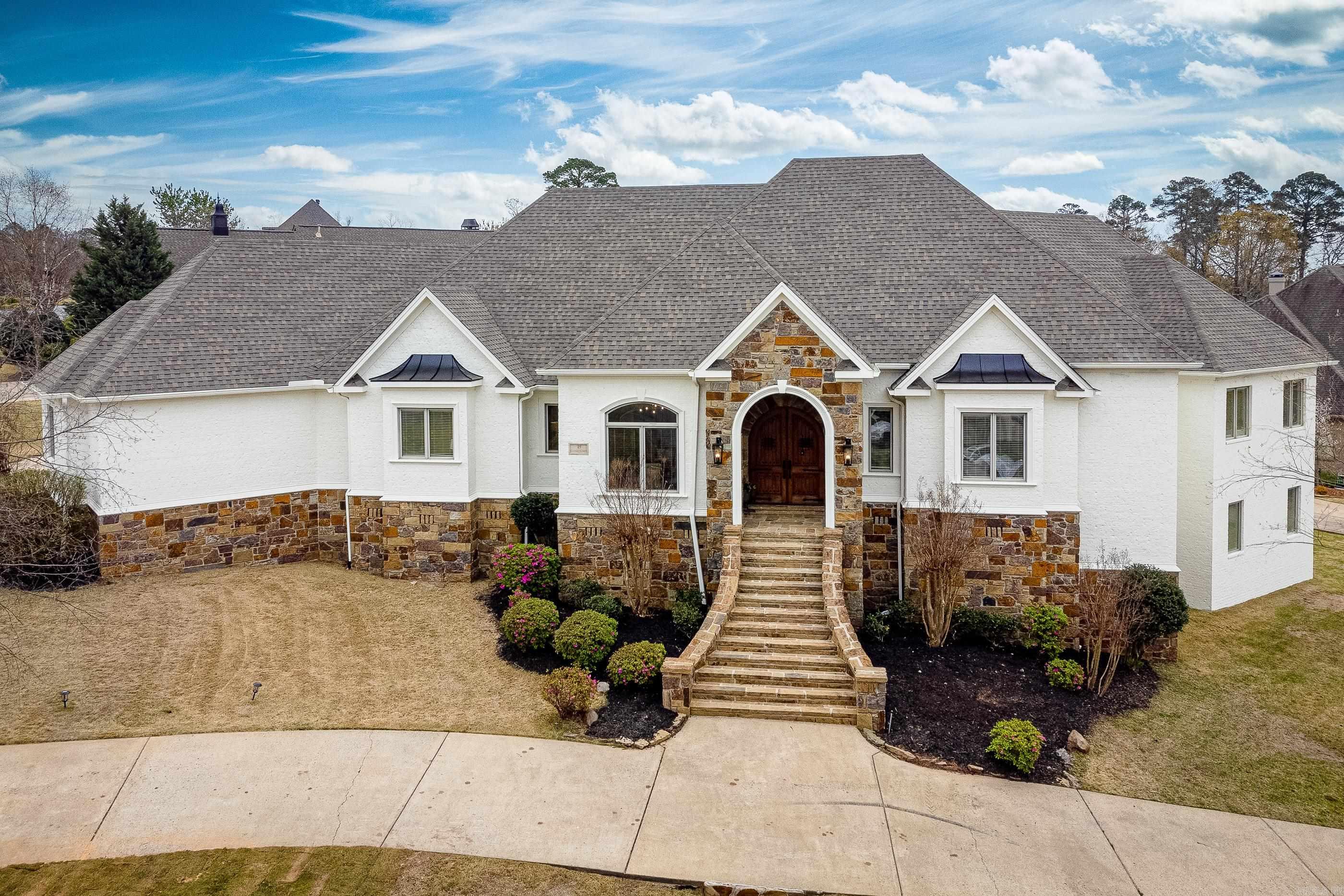 OWNER FINANCING AVAILABLE This spectacular Home in Germay of Chenal Valley boasts and extraordinary floor plan that's the perfect setting for family living and entertaining friends. Main level includes an exquisite living space, a gourmet kitchen that flows into large hearth room, and a large banquet dining room. The luxurious master suite and home office along with full guest/in-law suite on the main level. Downstairs is a game room, den, a wet bar, 2 bedroom en-suites, and an outdoor terrace. Large 3 Car side/rear loading garage all sitting on almost half an acre, this home offers everything you've been looking for! SEE AGENT REMARKS