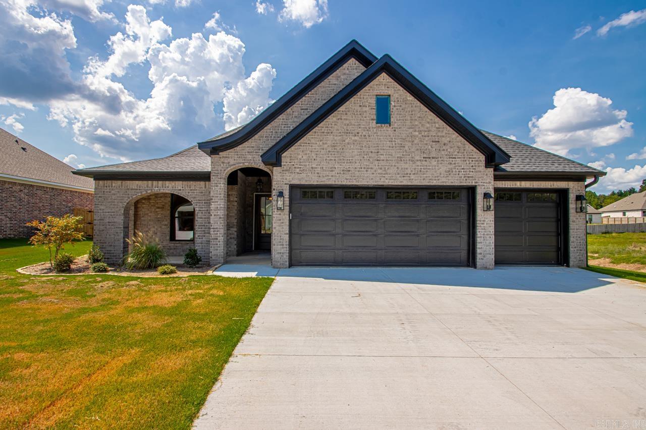 Beautiful New Construction Home located in the new Roman Heights Subdivision.. Amenities Include: Approximately 2184 SF, 4 Bedrooms, 2 Bathrooms, Living Room with gas log fireplace, Open Floor Plan, Kitchen/Dining Combo, Living/Dining Combo, Large Kitchen Island, Breakfast Bar, Split Bedroom Floorplan, Custom Tile Shower, Pantry, Laundry Room, LVP Flooring in main areas, Nice Lot, Covered Rear Patio with wood burning fireplace, Covered Front Porch, 3 Car Garage, Bryant Schools, And Much More. A Must See....