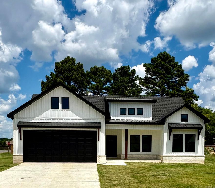 Welcome to this move in ready new construction home in  the new East Meadow subdivision in Greenbrier. Built by New Land Construction, this stunning home combines elegance with functionality, making it ideal for everyday living and hosting guests. The open floor plan has a gas log fireplace and granite countertops, which creates a spacious and inviting living space. Covered large porches on front and back create the perfect place  for outdoor relaxation and   entertainment. The separate primary bedroom connects with a bath with double granite vanities and a custom walk in tile shower. Custom closets for efficient storage completes this unique home. This home has been staged to help you picture the possibilities- schedule your showing today!