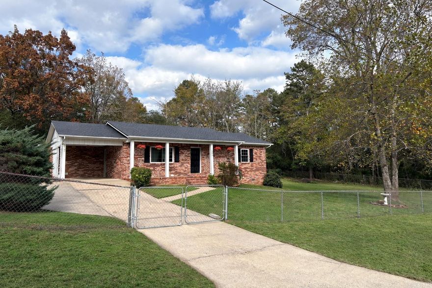 This charming 3 bedroom, 2 bath brick home sits on a corner lot in a quiet subdivision right in the center of town! Situated on two city lots, this property offers space, convenience and comfort all in one. Move right in and enjoy the many recent updates - new luxury vinyl plank flooring, new energy-efficient windows, new kitchen appliances, new disposal, new lighting fixtures, new shower heads, new floor vent covers and fresh paint throughout. The fully fenced-in yard is perfect for children or pets and there is a nice storage building in the back that could be used as a workshop or extra storage. A storm shelter provides peace of mind during chaotic Arkansas weather. The washer, dryer and refrigerator all convey, making this home truly move-in ready. This well maintained and updated home stands out from anything else on the market. Don't miss your opportunity to make it yours - schedule your showing today!  **Be sure to check out the 3D virtual tour and the YouTube video, both linked in the data sheet.**