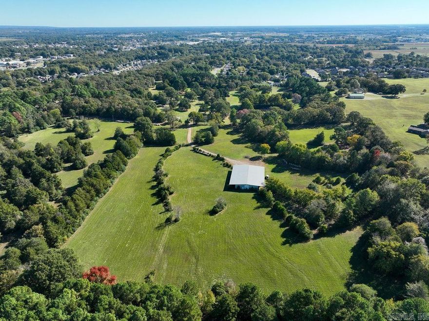 They aren't making land like this anymore! Location. Location. Location. This Skyline Drive property is a rare find with 30 magnificent acres. This property is close to Harding University, downtown Searcy and Beebe-Capps Expressway.   Located in a scenic valley with stately trees and privacy, a large metal barn is also on the property. The barn has water and electricity and can house two motor homes for the family who wants a place to stay while they build their dream home. The doors also have motors for your convenience.  The large parcel is the perfect place for a family to create their own private homestead with close amenities near by and includes Searcy Country Club  Your new beginning is waiting for you in this serene valley on Skyline Drive. Choosing where to build on such a large, varied 30-acre tract in a serene valley will be a rewarding experience.  Don't miss the video: https://dringcreative.pixieset.com/919skyline-1/  Call and schedule an appointment today.