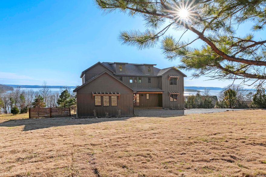 Lake Luxury, Discover your dream home w boat slip at Greers Ferry Lake! This stunning 4-bedroom, 3.5 Bth, hosting 2-master suite residence offers breathtaking lake views from every level. Enjoy private escapes on your expansive upper & lower decks, featuring many windows & glass doors for unobstructed vista views.Inside, you'll find high-end finishes throughout, including, delta & kohler fixtures, quartz countertops, stainless steel KitchenAid appliances, wine & drink coolers, Ice machine, custom OPI-stained cabinetry, Anderson windows, & a striking 3 panel Southernwood glass front door allowing an 8ft wide opening to allow the outside air in & vise versa, The open-concept living space features 12mm wood flooring,a floor to-ceiling propane fireplace, and a tankless water heater for efficient comfort.With over 3,200 square feet of heated and cooled living space & a massive under-roof area of nearly 7,100 square feet, this home offers ample room for entertaining & relaxation. The minimal landscaping & convenient lakefront easement make it easy to enjoy the outdoors. Lake access right from your back door and at Tannenbaum offers a lakefront Party Area,boat ramp and Golf Course nearby!