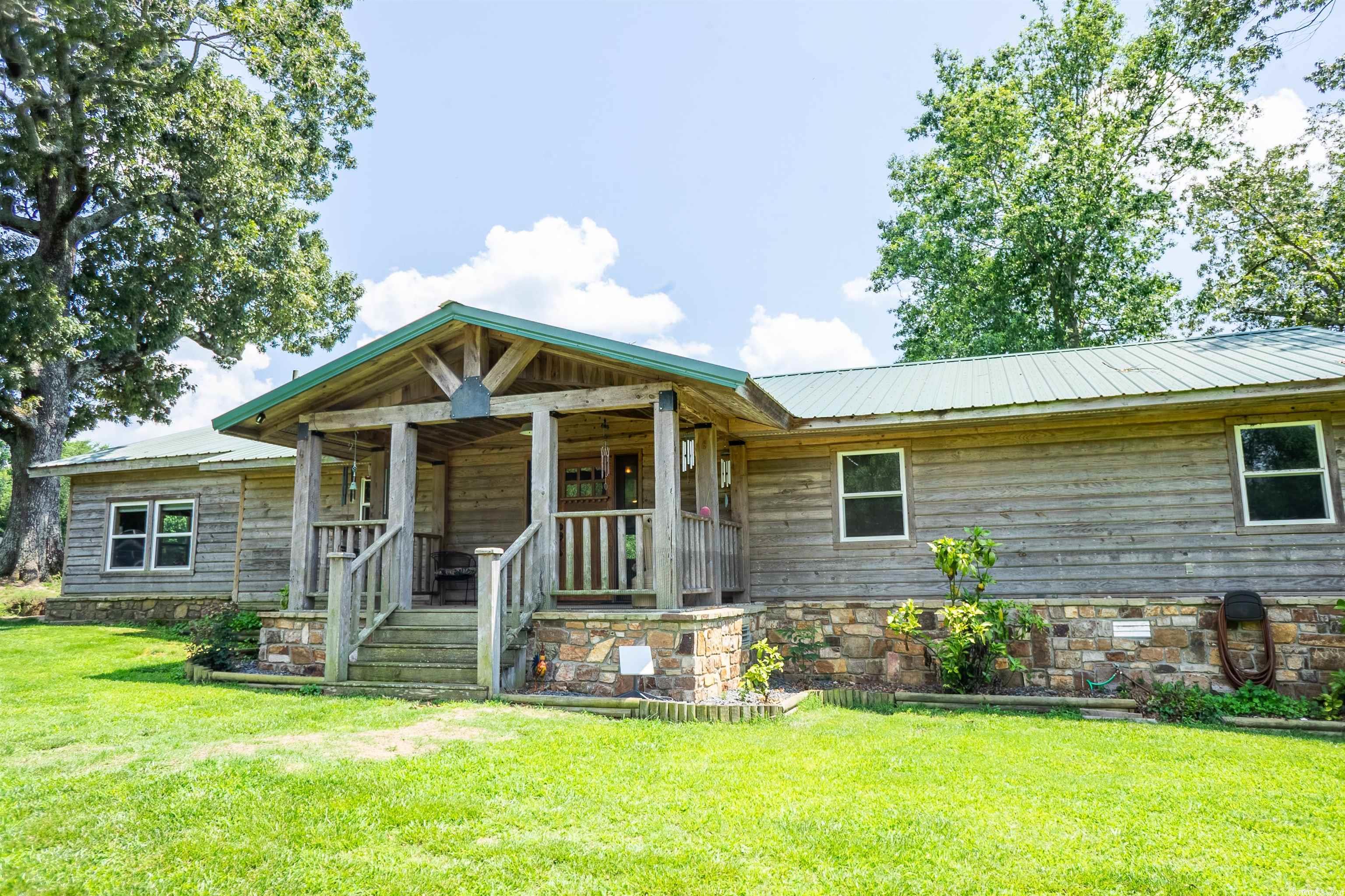 IMMACULATE!! This beautiful farm is as well kept and squared away as you will find. Completely fenced and crossed fenced for livestock. 2 nice sized stock ponds with fish. Lots of wildlife. Nice mixture of improved pasture and woods. House is move in ready with some nice features to welcome you home. Garden area, drilled water well, old hand dug well and a GIANT Red Oak tree in the yard. Drilled well services the residence. Very nice 40x60 Red Iron shop for all your stuff. Shed for parking your tractor/ side by side with chicken coop attached so you have eggs for breakfast. Combo Shed for your yard tools on one end and office/crafting area on the other. Large Hay barn round out the numerous outbuildings this great place has to offer.