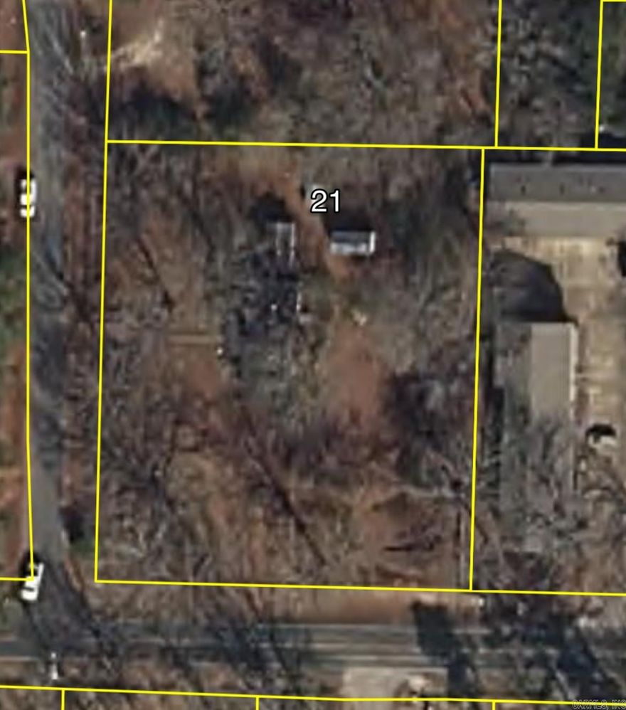 1.2 acres on the corner of Jacksonville Cutoff and Gibson is a great location to build your new home or a great opportunity for an investor to have it rezoned for multifamily residences, duplexes, triplexes, apartments, etc. Water, electric, and sewer hook ups all already here! No mobile homes allowed. The house and buildings are NOT to be entered for safety reasons.