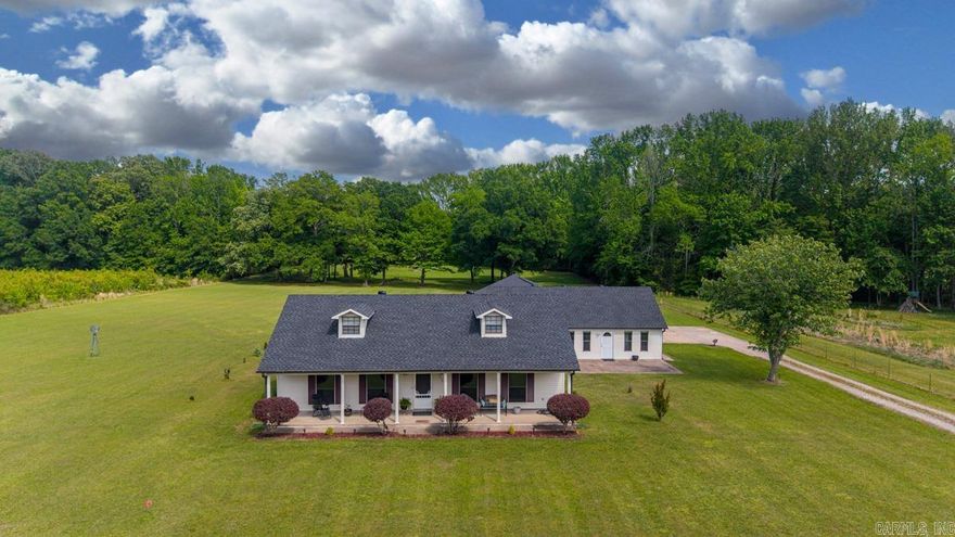 Set on 4 level, cleared acres in Beebe, this property offers the kind of space and calm that is getting harder to find. As you pull in, you are immediately met with a sense of privacy and openness, with a few mature trees in the back adding character without limiting usability. Inside, the main home offers approximately 1,779 square feet with 3 bedrooms and 2 full bathrooms. The kitchen opens naturally into the living and dining areas, creating a layout that feels connected and easy to live in. Just off the main living space, a sunroom brings in natural light and gives you a place to slow down, with sliding doors leading out to the back patio and privacy fenced yard. The detached 5 bay garage connects to a guest house with approximately 800 square feet of additional living space, complete with its own full bathroom and laundry room. Both the main home and guest house received new roofs in 2024, adding peace of mind to a property that already offers so much. If you have been looking for a place that feels peaceful, functional, and a little bit different from everything else on the market, this one is worth experiencing in person.