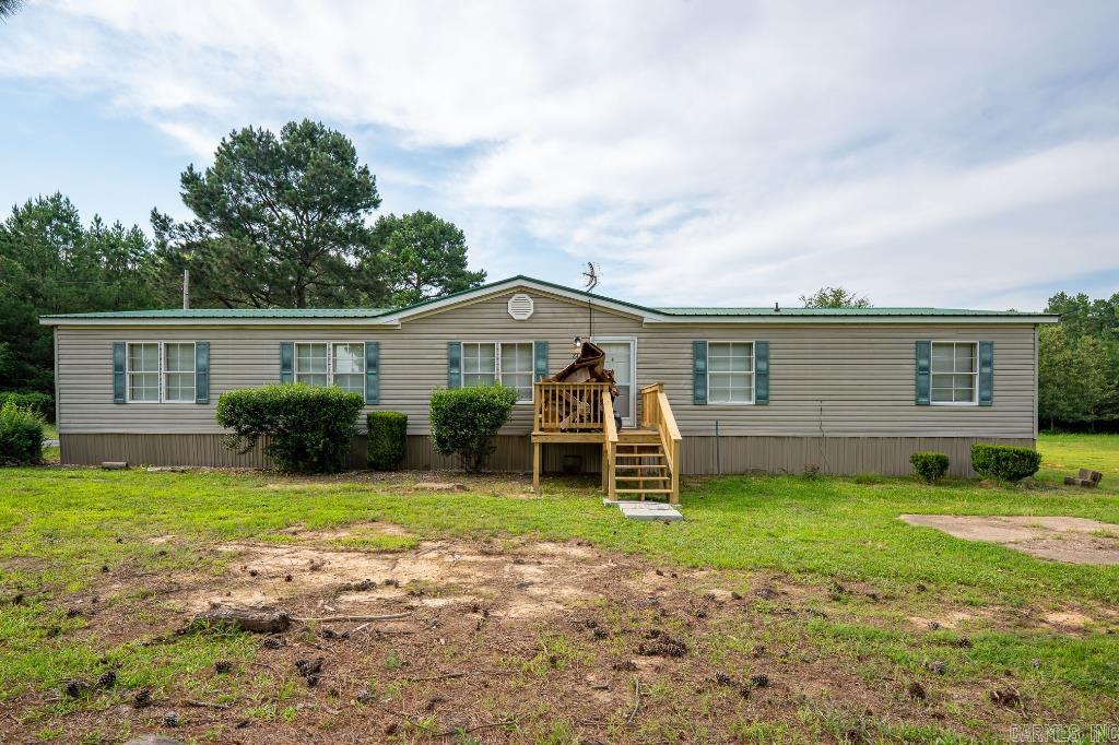 Country living with acreage. Large home has 5 bedrooms and 3 baths, fireplace, large living rm, laundry room, spacious kitchen. There is also a storm cellar, Shop/barn. New paint, flooring, and appliances.