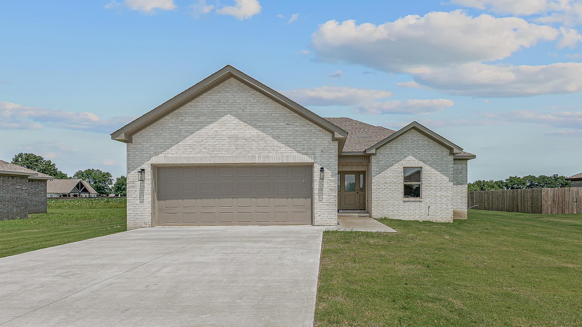 Enjoy the perfect combination of style and functionality with this 3 bedroom 2 bath home that boasts white cabinetry, a fireplace, open floor plan and LVP flooring, The open floor plan seamlessly connects the living, dining and kitchen areas, creating a spacious, inviting atmosphere.
