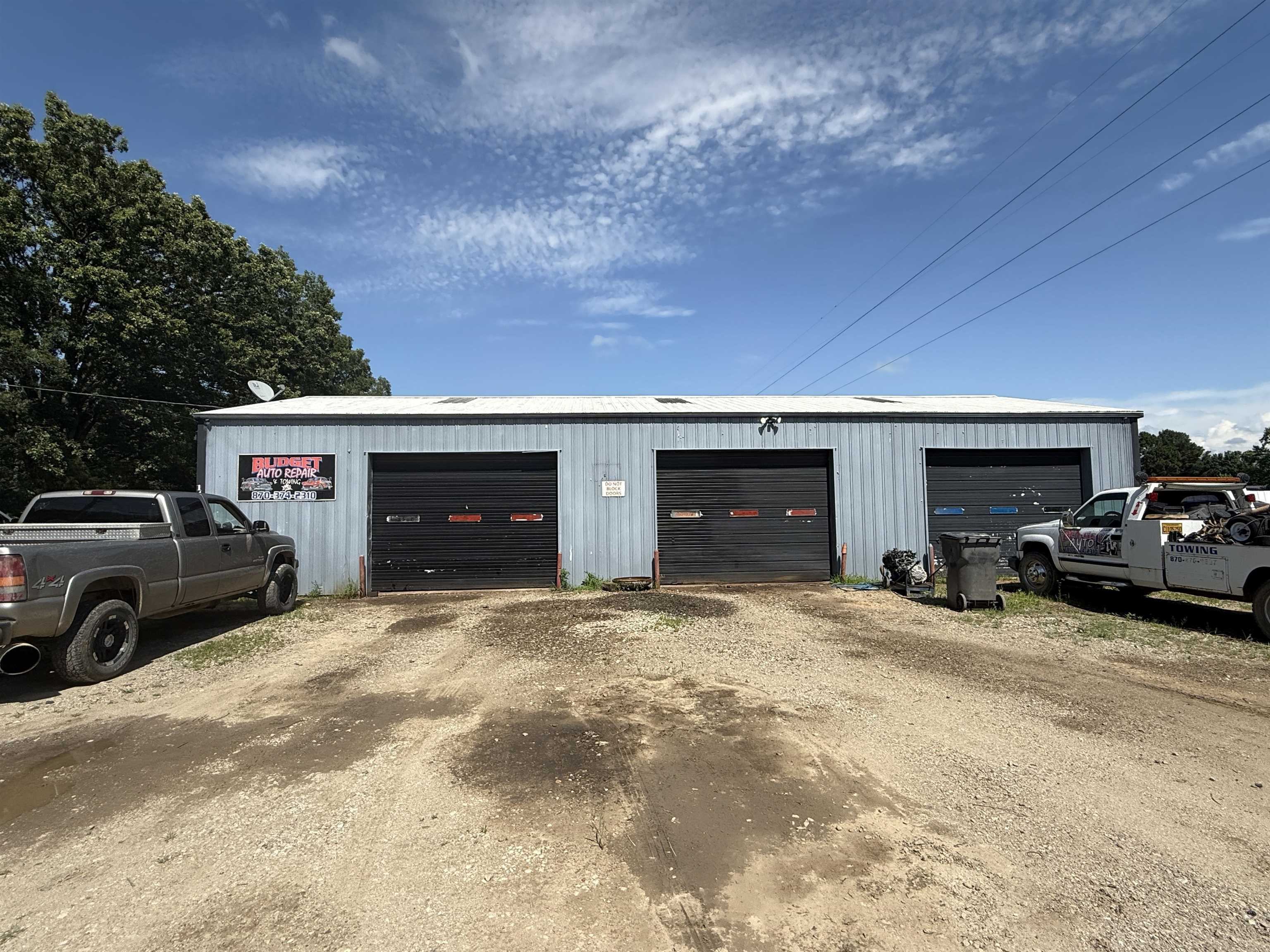Looking for a versatile commercial space with room to grow? This C1-zoned property is ideal for small business owners, mechanics, or investors looking for a ready-to-go location with serious potential. The building is 1,890sqft and it includes three bays, a small office, and a restroom. The building has a 200-amp service to power all of your tools and equipment. Out back you will find approximately 1/4 of an acre completely fenced in for added security. There is a private drive that runs the full length of the property providing direct access to the rear without disrupting the operations in the front. The sale is for the building and land only, however, the turn-key operation can be discussed and negotiated.