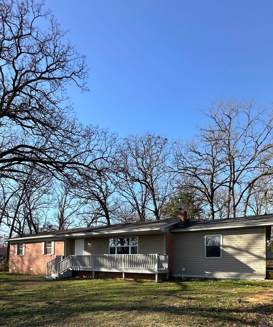 Begin your morning with a cup of coffee and take in the scenery from the front porch of this updated three-bedroom residence, featuring two full baths and an extra room that's ideal for use as a fourth bedroom or office, all situated on about 2 acres with a pond. This property includes a detached shop and outbuilding, perfect for storing toys or equipment, and has received updates including new paint, flooring, doors, cabinets, kitchen countertops and sink, bathroom vanities, toilets, and sinks, plus a new water heater and dishwasher. Located near Jack Nolan Lake, Vache Grass Country Club/Golf Course, schools, and shopping areas. An additional estimated 1.5 acres +/- to the east is available for added space. MLS 1071996 Public water is accessible at the street.