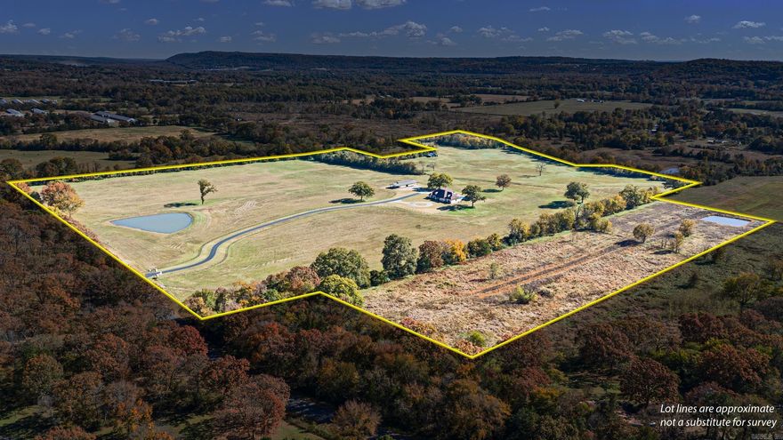 Discover unmatched privacy, space, and custom craftsmanship in this exceptional estate home set on approximately 69.5 acres right on the edge of town.  Designed with both comfort and elegance in mind, the home features expansive living areas, custom finishes, and thoughtful design throughout. The main floor features an open custom kitchen to living space with fireplace. Upstairs features open flexible, game or second living complete with 1/2 bath.  Step outside and enjoy resort-style living with a sparkling in-ground pool, perfect for entertaining or relaxing in total privacy. The acreage includes multiple ponds, and rolling fields—ideal for recreation, livestock, or simply taking in the peaceful surroundings. A rare find complete with a detached shop with extended overhangs, a barn, and ample room for equipment, hobbies, or animals. This is more than a home—it’s an estate designed for lifestyle, comfort, and legacy.