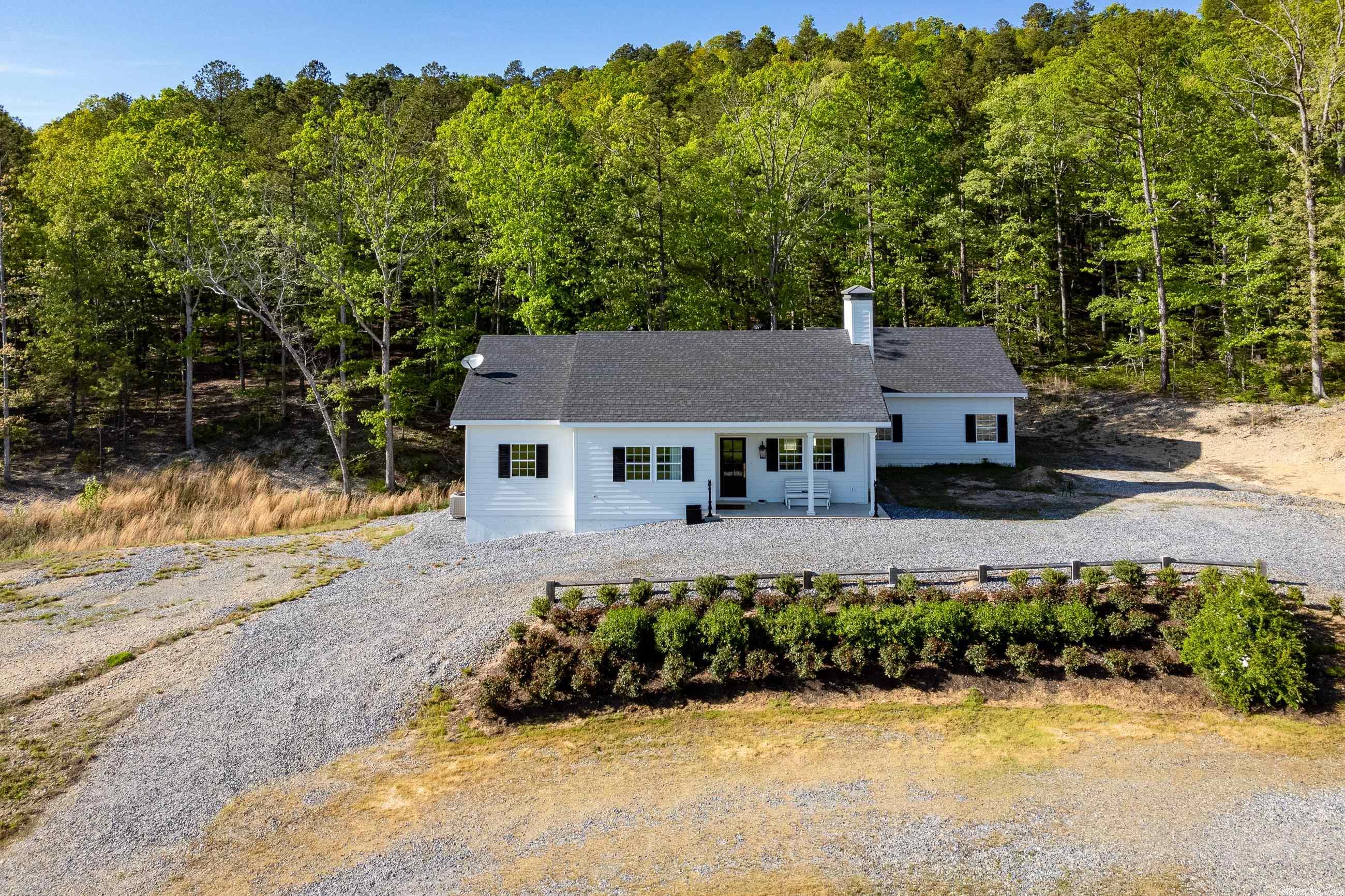 Gorgeous Kanis Road property on over 40 beautiful acres. Newly built features handsome exterior and functional interior. Horizontal hardy board siding, wide eaves and welcoming covered front porch combine beautifully to create relaxing atmosphere. The perfect setting for family living or weekend getaway. The home built by Jack Hartsell is situated on a basement foundation which almost doubles the square footage of the home and provides plenty of room for expansion/storage. Nine-foot ceilings and abundant windows add to the spacious feel. There are several outbuildings custom designed for horse and dog owners. The main barn features a tack room, heat and cooled office, feed room and two horse stalls. It also has a concrete floored grooming area with 100 gal HWH. There is a large, fenced area for the dogs which includes 30 x 20 dog kennel. Other out buildings include 2 pasture shelters and 20 x 30 metal building. Beautiful topography with scenic views.