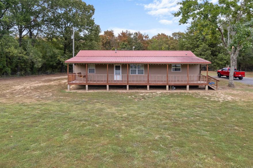 Rare Find! Welcome to this cute and immaculate country home! Upon arriving at the property you will notice the property is fully fenced w/gate at the road. Entering the property you see the large covered front deck and the rear covered deck too. Not to mention the shop and more onsite as well! Entering the home you immediately are welcomed by the fresh and clean neutral tones of paint throughout the home. The Living Room is centrally located w/a spacious Eat in Kitchen and Bath off the rear of the home. Also off the Living Room is the hallway and guest bedrooms as well as the Master Bedroom and Bath too! The Master Bedroom faces rear on the home as well. This home boasts a combination of tile, laminate and vinyl floors for easy cleaning and maintenance too. On the property you have a garden space as well as a chicken coop space too. The home is covered by vinyl siding and a metal roof. The approx 24x30 shop is a metal building shop with metal roof too.  You will want to see this home if you are seeking a home with a little acreage. See Agent Remarks.